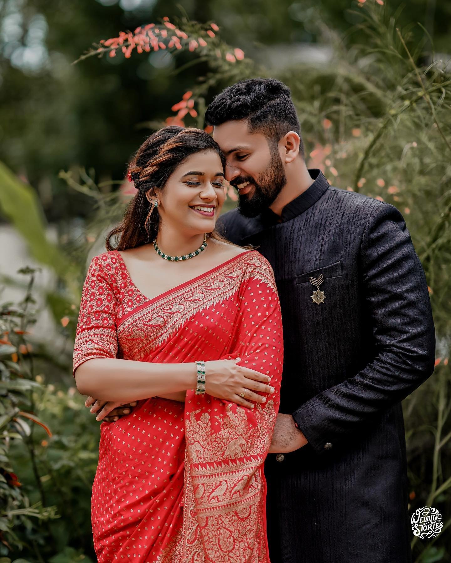 A couple in wedding attire sharing a quiet embrace