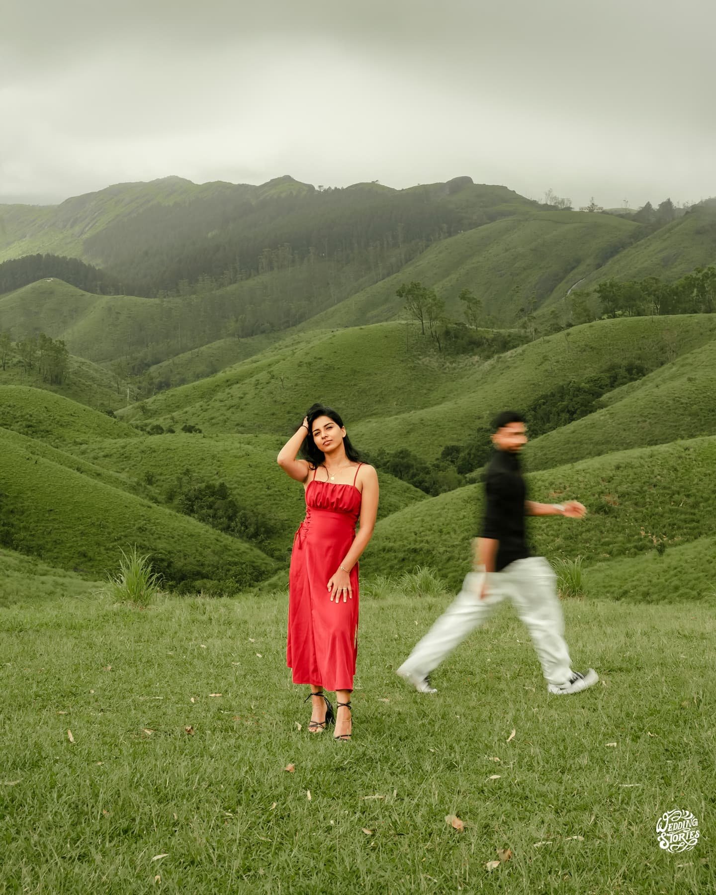 A couple walking through rolling green hills